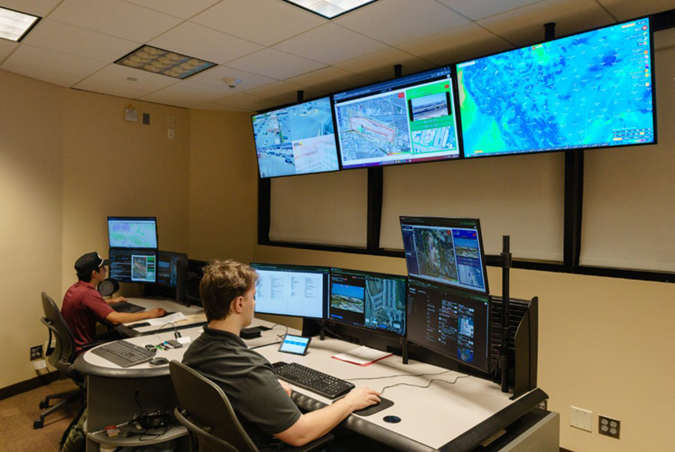 BNSF drone pilots Lorenzo Gomez, left, and Matthew Powell work in the new Flight Operations Center.
