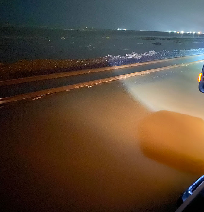 Flooded tracks at night